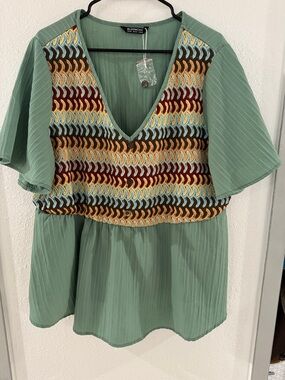 BloomChic Sage Green V-Neck Peplum Top with Multicolor Crochet Panel